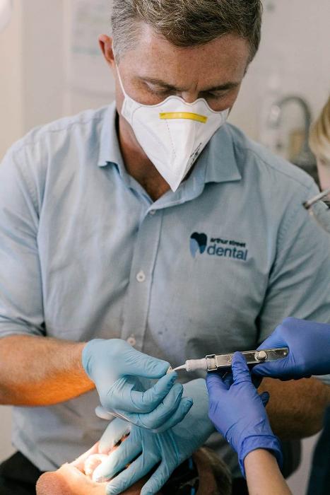 dental crowns coffs harbour | dr. ward placing dental crown