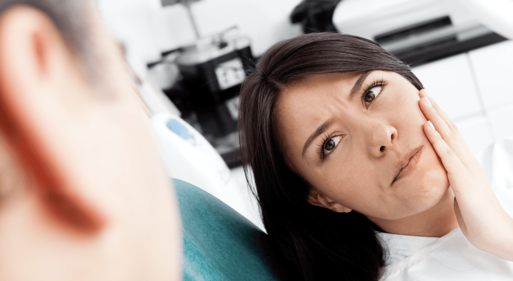 coffs harbour dentist | woman at the dentist with tooth pain