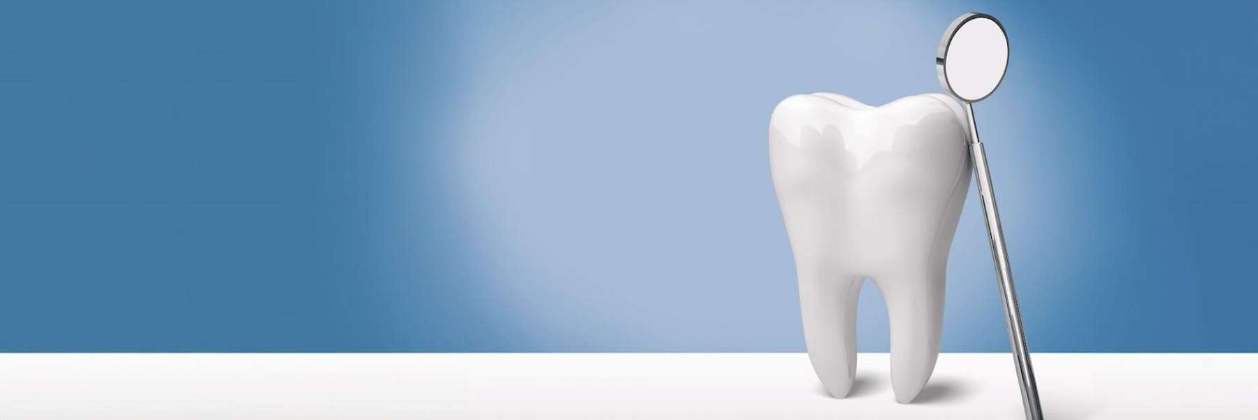 A picture of a tooth with a dental mirror