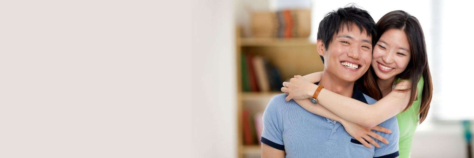 2 people smiling and hugging | dentist coffs harbour