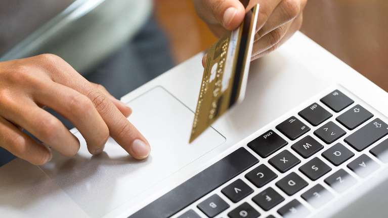 A person entering their credit card information online | payment information Coffs Harbour NSW