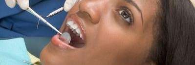 dental implant coffs harbour | A woman getting a dental exam in Coffs Harbour