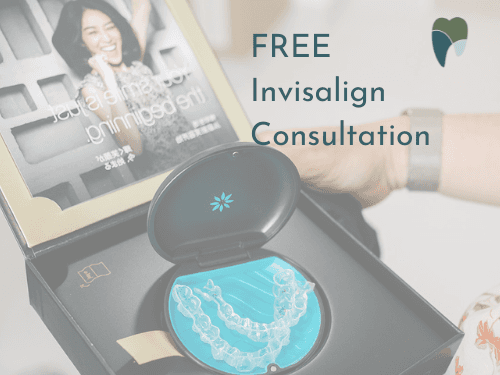 Invisalign Coffs Harbour | Patient holding up clear aligner trays